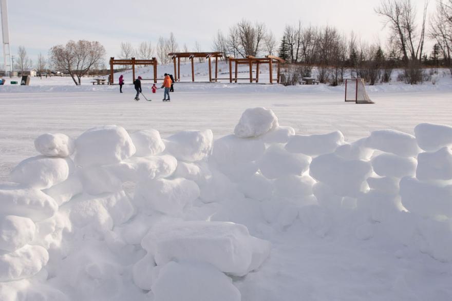 skating with snow fort in front in snow